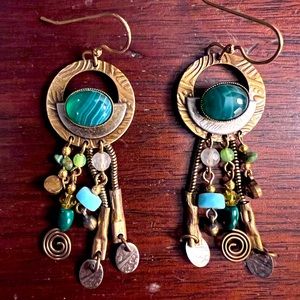 Super cool pair of hand made earrings with green stone.